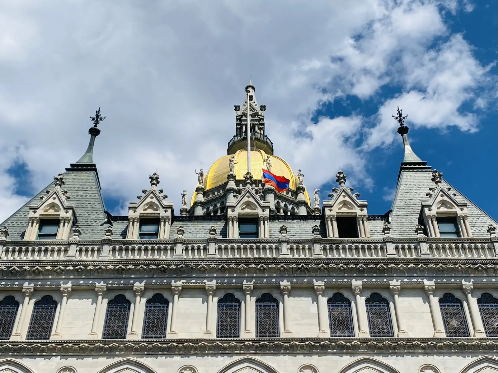 Close view of the Connecticut State Capitol's gold-leaf dome and Gothic spires
