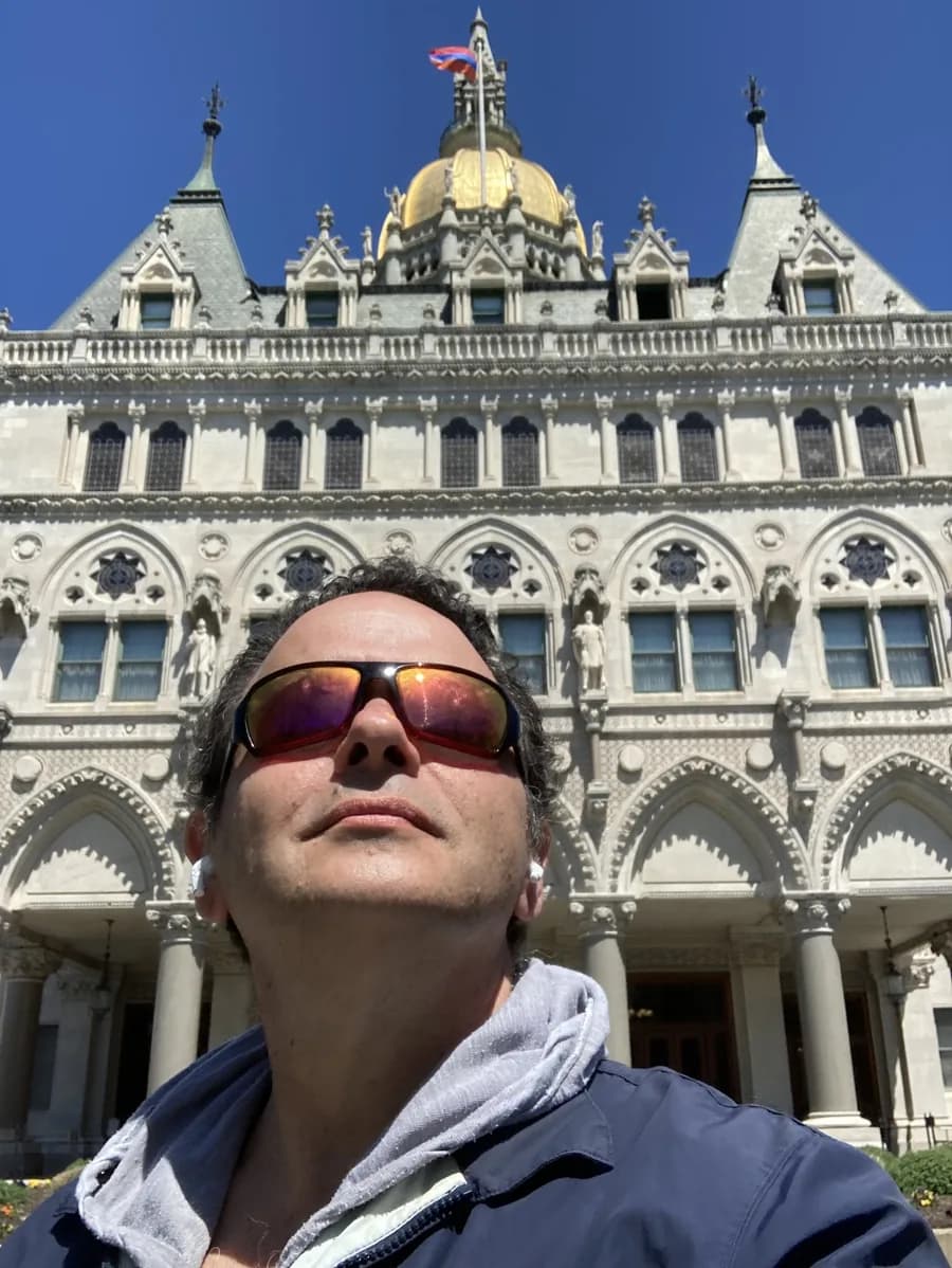 Dan Newmyer in front of the Connecticut State Capitol's gold dome in Hartford
